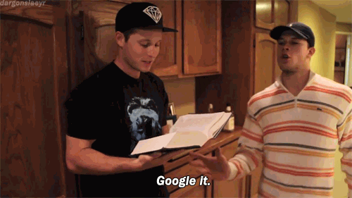 Man tossing his friend's book out of his hand saying 'Google it'