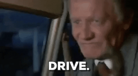 GIF of a guy saying 'DRIVE' in a taxi.