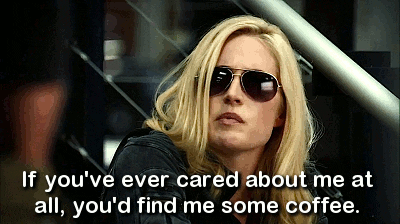 GIF of a woman wearing sunglasses looking hungover with the caption 'if you ever cared about me at all, you'll find me some coffee'